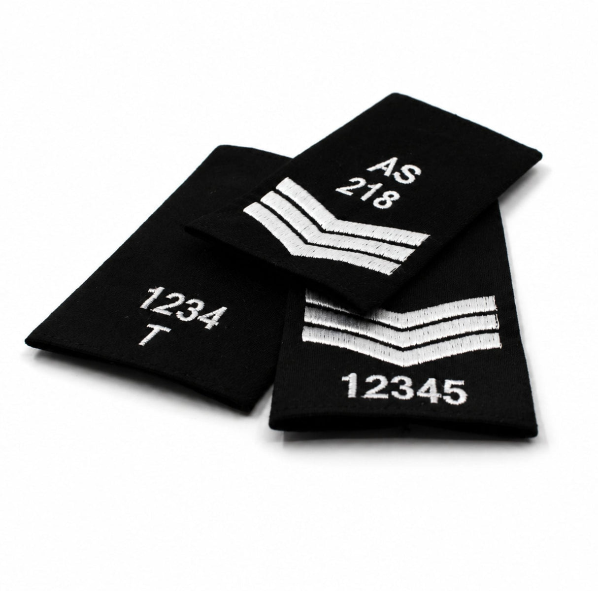 Custom embroidered black rank slide with white stitched numbers and rank markings