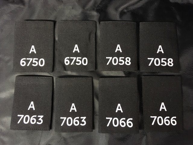 Police Surplus Police Uniform 9cm Epaulette Slides, black with white embroidered letter A and mixed numbers, 9cm length (Used – Grade A)
