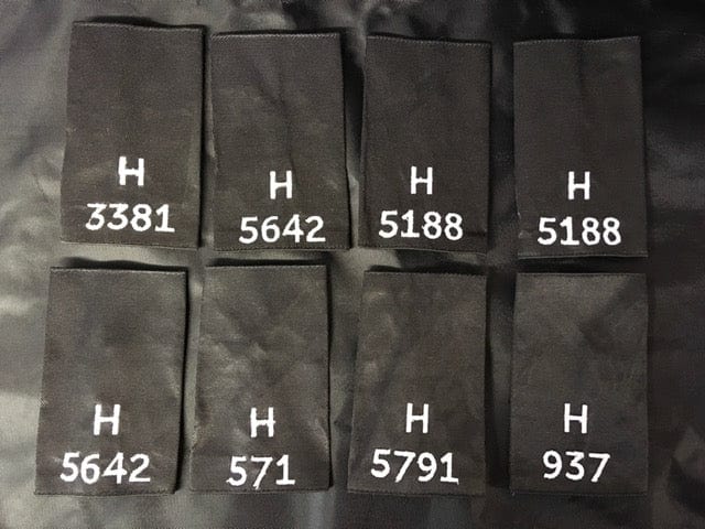 Police Surplus Police Uniform 11cm Epaulette Slides, black with white embroidered letter H and mixed numbers, 11cm length (Used – Grade A)