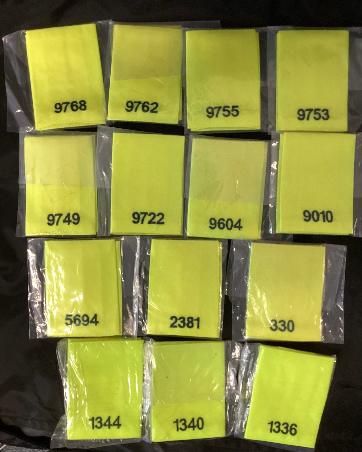 Police Surplus Police Uniform Epaulette Slides, Hi Vis yellow, black embroidered mixed numbers and lengths (Used – Grade A)