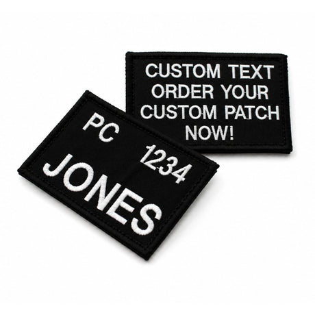 Custom embroidered black name tag with white stitched lettering