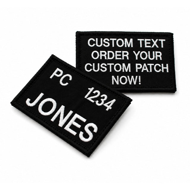 Custom embroidered black name tag with white stitched lettering