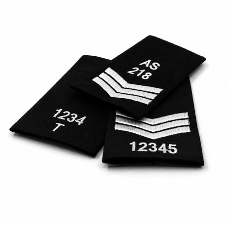 Custom embroidered black rank slide with white stitched numbers and rank markings