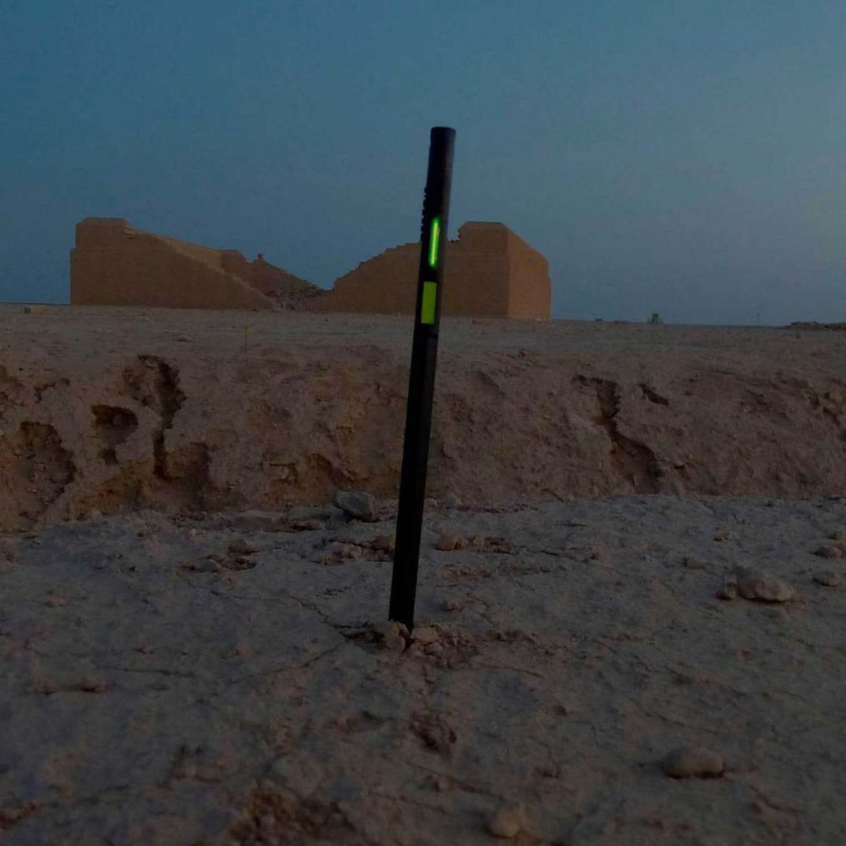 Firefly Arc of Fire Marker MK.II positioned in the ground outdoors at dusk