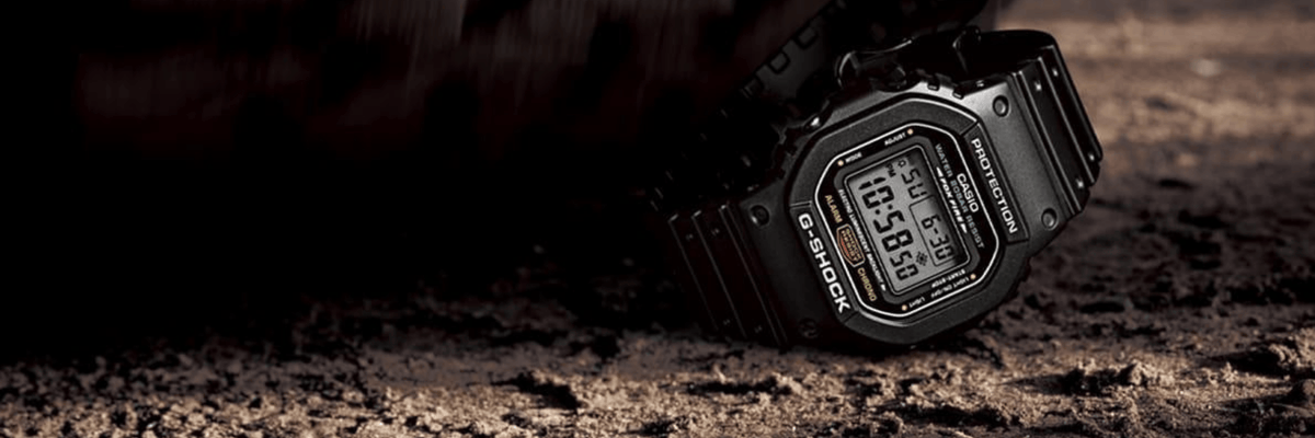 G-SHOCK Watch strength test, black classic G-SHOCK tactical watch being driven over by a truck