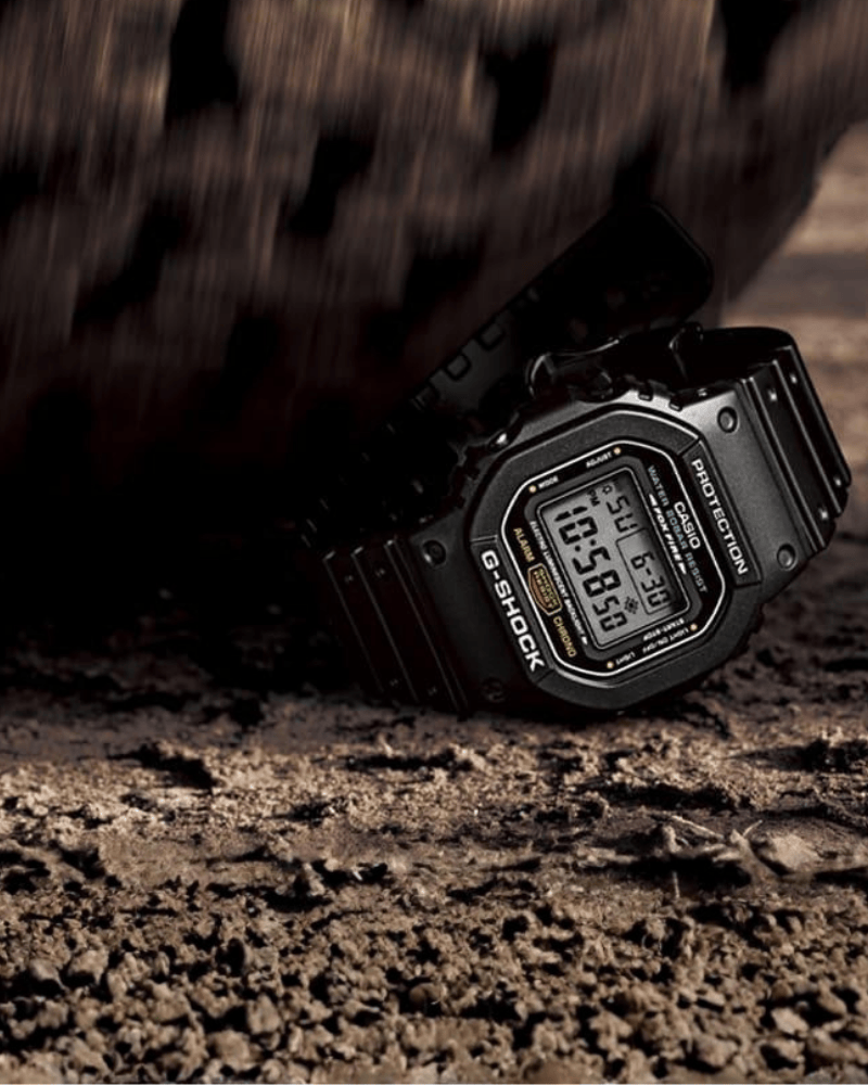 G-SHOCK Watch strength test, black tactical watch being driven over by a truck