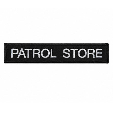 Personalised embroidered name tape patch with white lettering on black fabric for uniforms and tactical gear