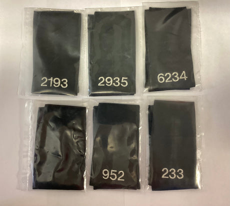 Police Surplus Police Uniform Epaulette Slides, black with silver embroidered mixed numbers and lengths (Used – Grade A)